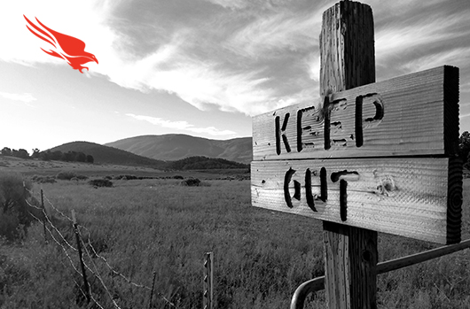 wooden keep out sign in grasslands